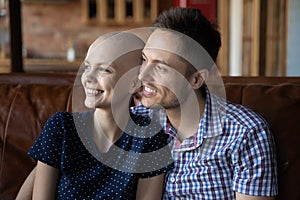 Happy young couple in love fighting with womans cancer