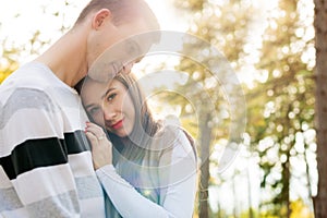 Happy young couple in love hugging. Park outdoors date. Loving couple