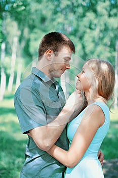 Happy young couple in love, kiss moment