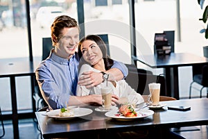 Happy young couple in love at romantic date in restaurant