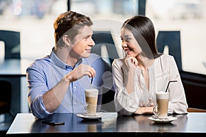 Happy young couple in love at romantic date in restaurant