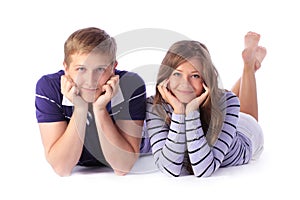 Happy young couple lying down on the floor