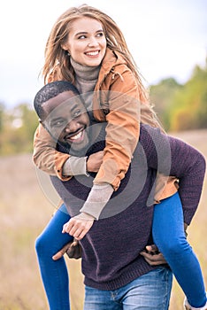 Happy young couple piggybacking