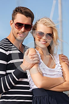 Happy young couple in port