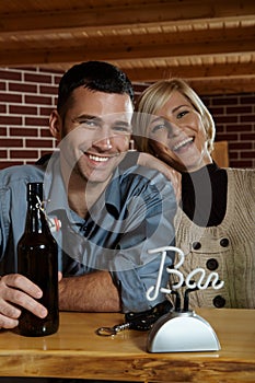 Happy young couple in pub