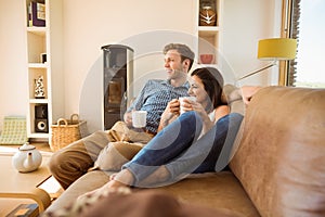 Happy young couple relaxing on the couch