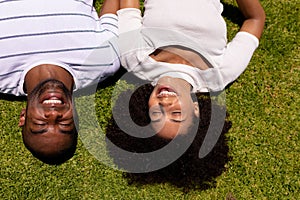 Happy young couple relaxing in the garden