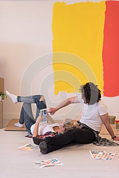 Happy young couple relaxing after painting