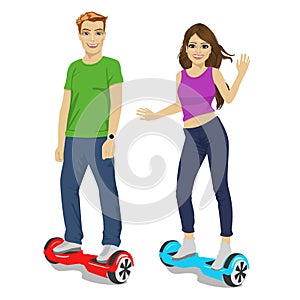 Happy young couple riding gyroscooter - eco transport, hoverboard, smart balance wheel