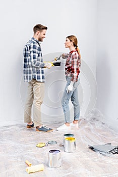 happy young couple in room during