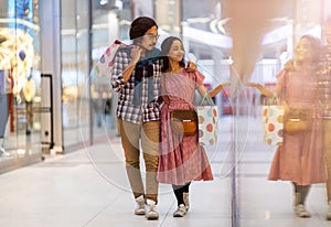 Happy young couple in shopping mall