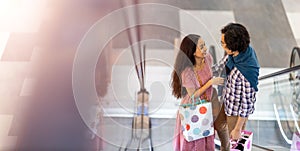 Happy young couple in shopping mall