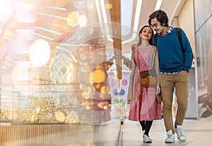 Happy young couple in shopping mall