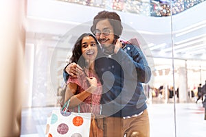 Happy young couple in shopping mall