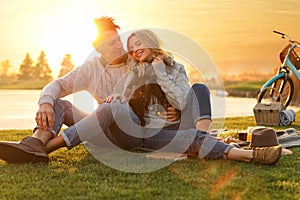 Happy young couple spending time together on picnic