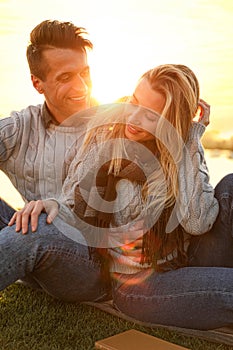 Happy young couple spending time together on picnic