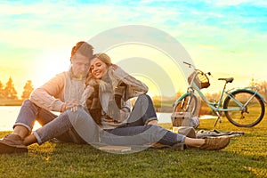 Happy young couple spending time together on picnic