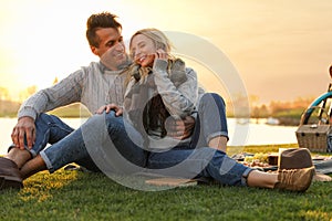 Happy young couple spending time together on picnic