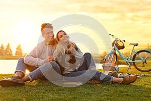 Happy young couple spending time together on picnic