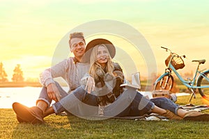 Happy young couple spending time together on picnic