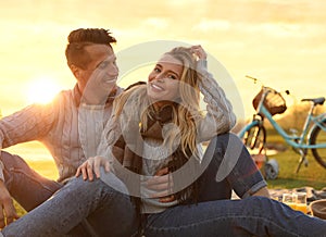 Happy young couple spending time together on picnic