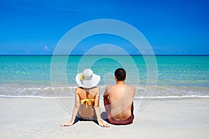 Happy young couple on summer holidays vacation on tropical beach