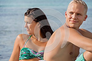 Happy young couple sunbathing