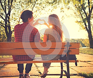 Happy young couple in sunny park