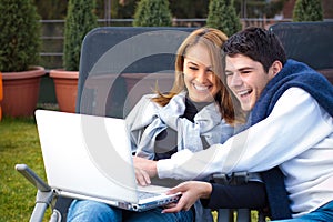 Happy Young couple surfing the internet