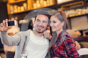 Happy young couple taking selfportrait