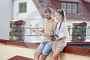 Happy Young Couple Traveling Together. Exploring City Map in City