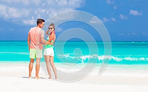 Happy young couple at tropical beach in Cuba