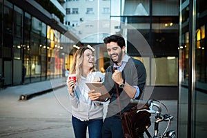 Happy young couple using a digital tablet together and smiling