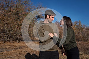 Happy Young Couple Walk In Autumn Park