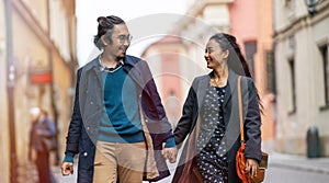 Happy young couple, walking through the old city