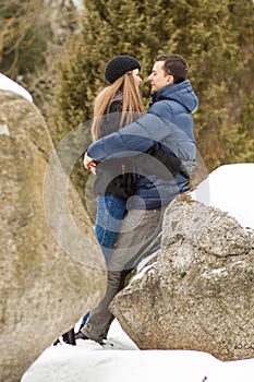 Happy Young Couple in Winter mountains