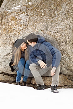 Happy Young Couple in Winter mountains