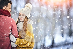 Happy Young Couple in Winter Park laughing and having fun. Family Outdoors. Copycpace.