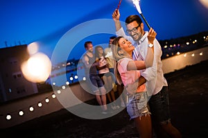 Happy young dancing couple having fun and enjoying party at summer