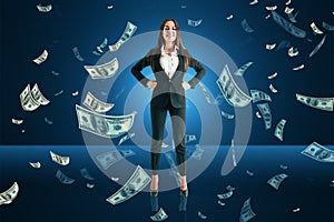Happy  european business woman with falling dollar bills on blue background. Success, lottery win and money concept