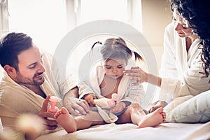 Happy young family after bath.