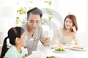 Happy young Family enjoy their dinner