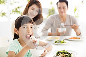 Happy young Family enjoy their dinner
