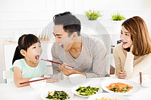 Happy young Family enjoy their lunch