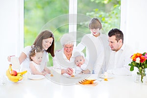 Happy young family enjoying Easter breakfast