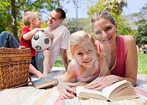 Happy young family enjoying a picnic