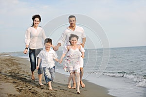 Happy young family have fun on beach