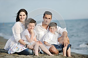 Happy young family have fun on beach