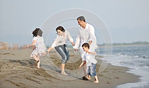 Happy young family have fun on beach