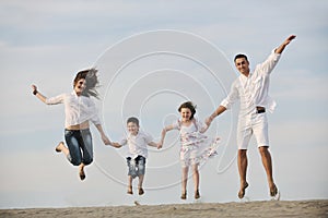 Happy young family have fun on beach